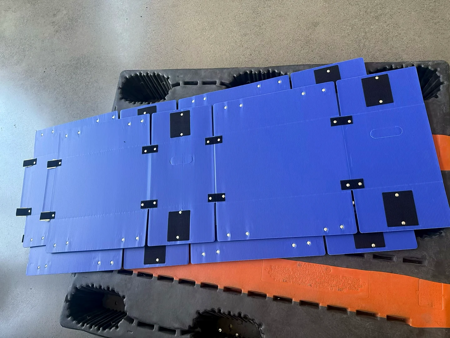 Flat-laid blue PP corrugated box components for RFQ dimension review
