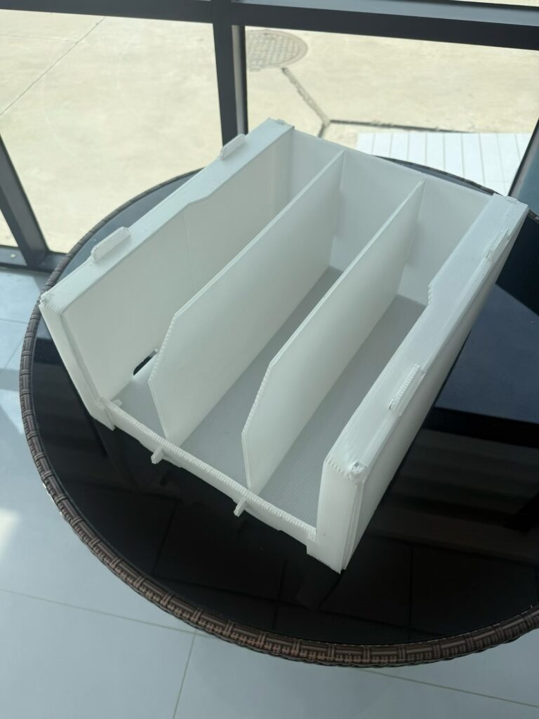 White corrugated plastic divider insert shown inside a box-shaped structure