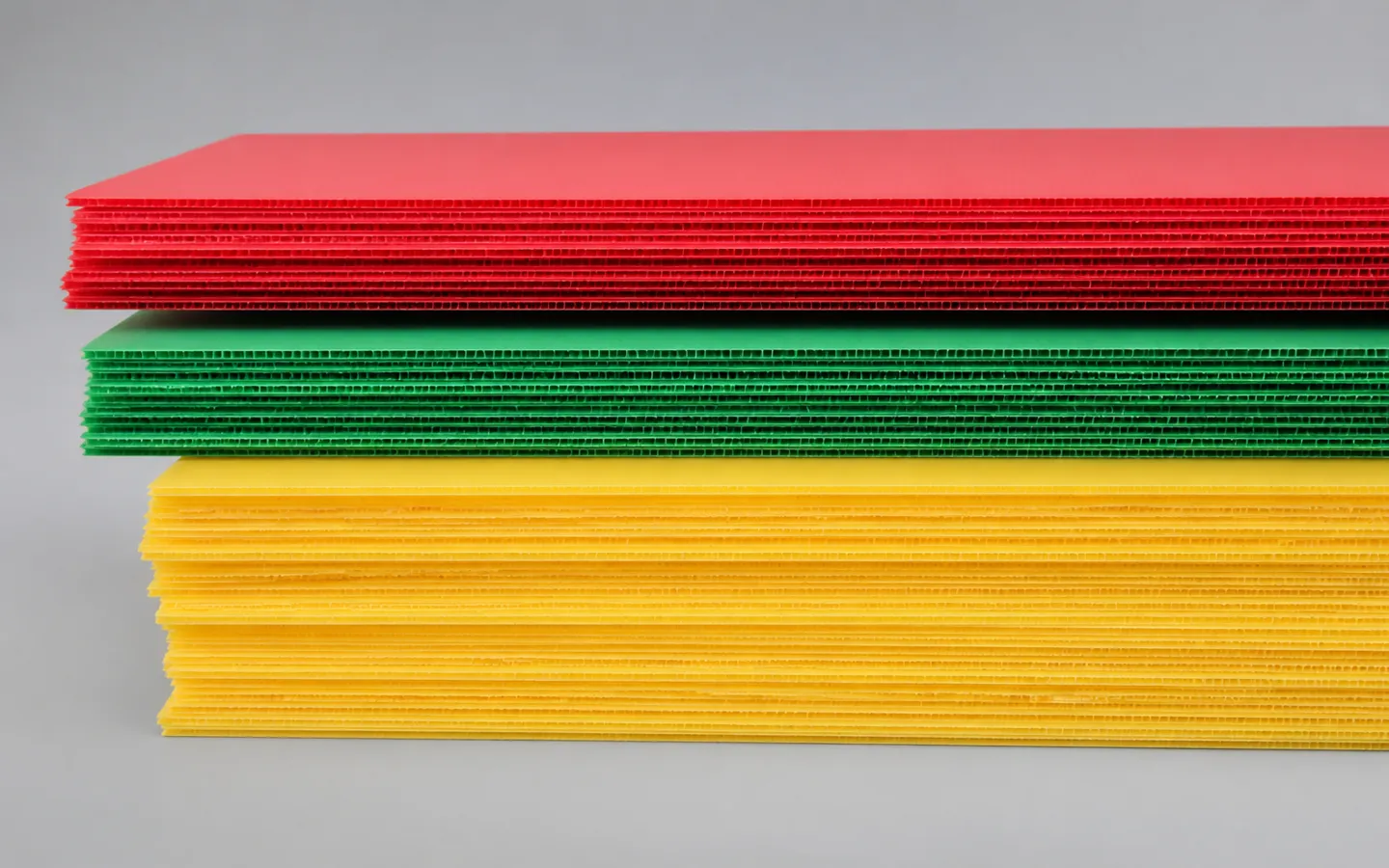 Colored twin-wall polypropylene sheets prepared for size review.