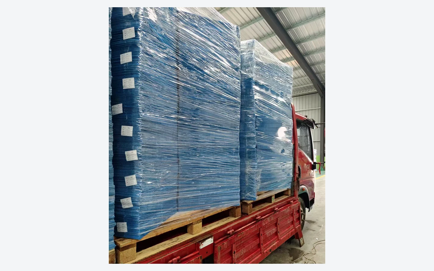 Palletized PP corrugated returnable packaging wrapped for transport