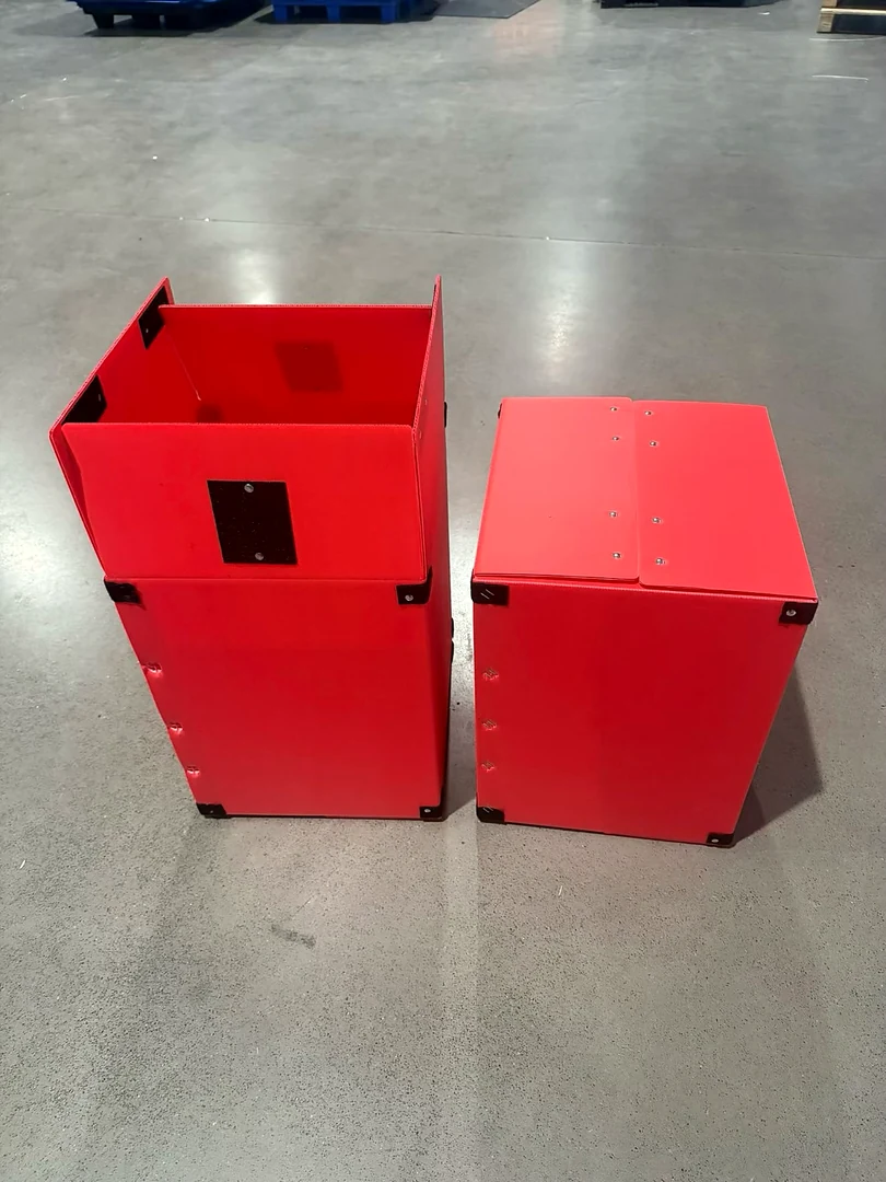 Red reusable PP corrugated containers stacked for repeated material handling cycles