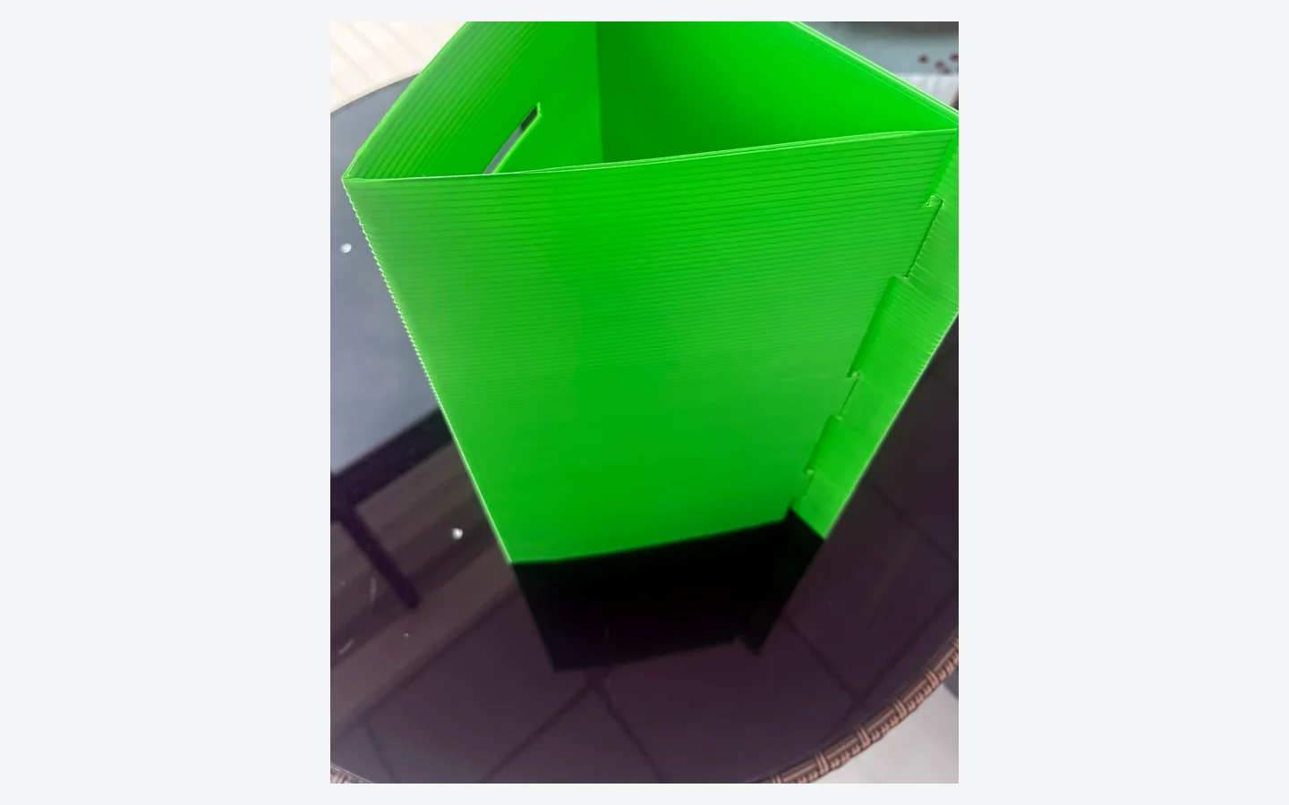 Green PP corrugated storage bin showing its custom open structure